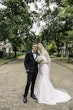 Bride wearing Mitchell Marie Vida by Maggie Sottero with her husband