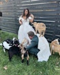 Bride Wearing Floral Ballgown Wedding Dress Called Derrick Marie With Goats And The Groom