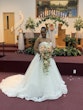 Bride Wearing White Lace Ball Gown 