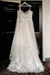 Pia wedding dress by Maggie Sottero hanging up