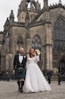 Bride wearing Nerida by Sottero and Midgley holding hands with her husband