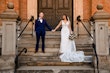 Bride wearing Hamilton wedding dress by Sottero and Midgley holding hands with her husband