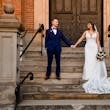 Bride wearing Hamilton wedding dress by Sottero and Midgley holding hands with her husband