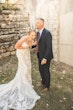 Bride Wearing Glamorous Lace And Sequin Wedding Dress Called Tuscany By Maggie Sottero Laughing With Groom