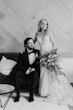 Groom With Bride Wearing Plunging Lace Illusion Wedding Dress Called Raelynn By Rebecca Ingram