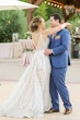 bride in deep illusion v-back  wedding dress called roxanne by sottero and midgley