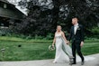 Bride Wearing Square Neck Wedding Dress Called Albany By Maggie Sottero Holding Hands With Groom