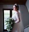 Bride wearing Lorraine Dawn wedding dress by Rebecca Ingram