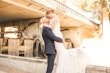 Groom Picks Up Bride Wearing Glamorous Lace And Sequin Wedding Dress Called Tuscany By Maggie Sottero Under Bridge