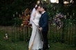 Bride wearing Kern by Maggie Sottero kissing her husband with brooms and swords