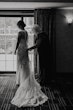 Bride wearing budget friendly fit and flare wedding dress
