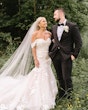 Bride wearing Hattie Lynette by Rebecca Ingram looking at her husband