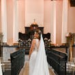 Bride wearing Hamilton wedding dress by Sottero and Midgley inside a church