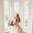 Bride wearing a plus size ballgown wedding dress.
