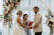 Bride wearing Indiana by Maggie Sottero being married at her ceremony