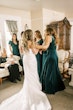 Bride wearing Clover by Rebecca Ingram talking with her bridesmaids