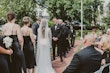 Groom looking sweetly at his bride at the altar.