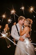 Bride Wearing Sparkly Ballgown Wedding Dress Called Shasta By Sottero And Midgley With Groom And Sparklers Surrounding Them