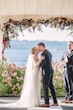 Bride Wearing Beaded Wedding Dress Called Luella By Sottero And Midgley Kissing Groom