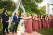 Fun Moment for Wedding Party at Altar. Bride in Beaded Chiffon Sheath Wedding Dress Called Lorraine by Rebecca Ingram