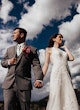 Bride Wearing Sexy Lace Wedding Dress Called Hazel By Rebecca Ingram And Groom Holding Hands