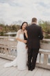 Bride wearing Clover by Rebecca Ingram with her husband