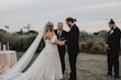 Bride In Lace A-Line Wedding Dress Called Hattie Lane By Rebecca Ingram With Groom