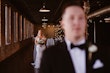 Bride Wearing Classic Elegant Wedding Dress Called Sebastiane By Maggie Sottero Holding Bouquet Behind Groom