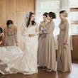 Bride Wearing Lacey Sheath Long Sleeve Wedding Dress Called Francesca By Maggie Sottero With Bridesmaids Dress Train