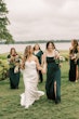 Bride wearing Clover by Rebecca Ingram walking with her bridesmaids