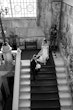 Bride wearing Cecilia by Rebecca Ingram walking down the stairs with her husband