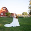 Bride Standing in Barn Feild in Savannah Wedding Dress Called Savannah by Maggie Sottero.
