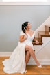 Bride wearing Ekaterina by Maggie Sottero sitting on the stairs