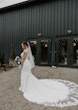 Real Bride Posing In White Wedding Dress Named Sadie By Rebecca Ingram