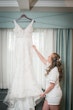 Bride Showing Off Wedding Dress Called Delilah By Maggie Sottero While Getting Ready