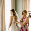 Bride wearing affordable floral ballgown wedding dress.