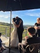 Bride wearing Darius wedding dress by Maggie Sottero kissing her husband