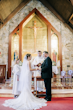 Groom and Bride Wearing Nature Lace Wedding Dress Called Albany By Maggie Sottero At A Chapel Ceremony