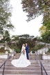 Bride wearing Ulanda wedding dress by Maggie Sottero with groom