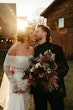 Groom Kissing Bride Wearing Pearl Sparkly Wedding Dress Called Drew By Maggie Sottero