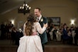 Bride wearing Seneca wedding dress by Sottero and Midgley dancing with her husband