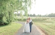 Bride in lace ball gown wedding dress called meryl by Maggie Sottero with groom first look