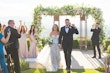 Bride Wearing Lace Fit-n-flare Wedding Dress Called Nyjah By Sottero And Midgley Walking With Groom