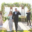 Bride Wearing Lace Fit-n-flare Wedding Dress Called Nyjah By Sottero And Midgley Walking With Groom