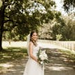 Bride wearing affordable floral ballgown wedding dress.