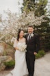 Bride wearing Clover by Rebecca Ingram with her husband