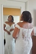 Bride wearing off the shoulder lace wedding dress