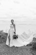 Bride Wearing Sexy Strapless Wedding Dress Called Zelda By Rebecca Ingram On A Beach Lake