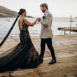 Bride Wearing Black Fit And Flare Wedding Dress Called Zander Lane By Sottero And Midgley With Groom On A Pier