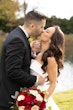 Bride wearing Mitchell Marie by Maggie Sottero kissing her husband